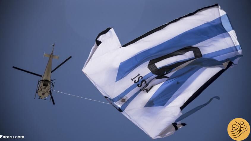 (عکس) حمل پیراهن غول‌پیکر مسی با هلیکوپتر