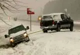 گیر کردن خودروها در برف سنگین آیووا