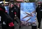 ببینید؛ شرکت اعضای حزب الله با اسلحه در مراسم عزاداری محرم خبرساز شد