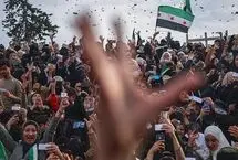 پخش شیرینی به مناسبت صدور حکم اعدام بشار اسد