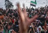 پخش شیرینی به مناسبت صدور حکم اعدام بشار اسد