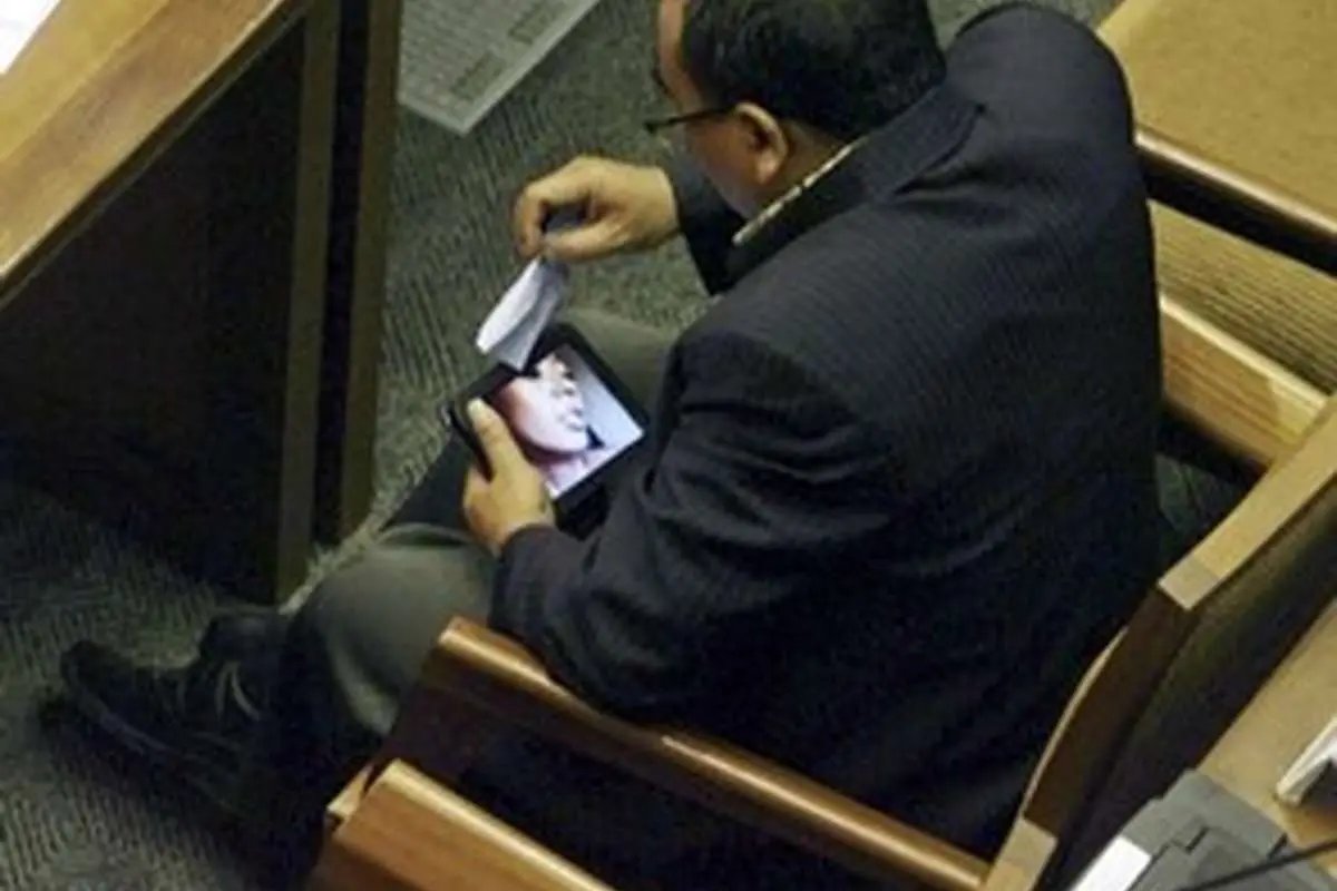 A woman in a dramatic pose with a concerned expression