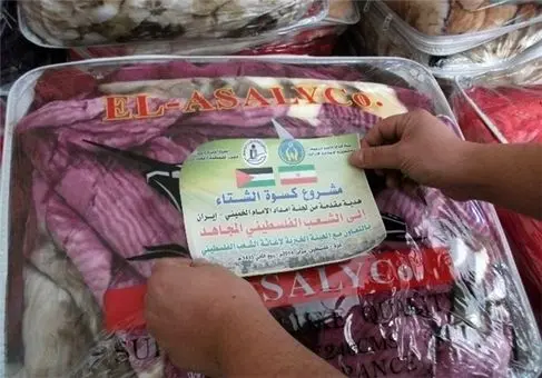 (تصاوير) توزیع پوشاک کمیته امداد در غزه