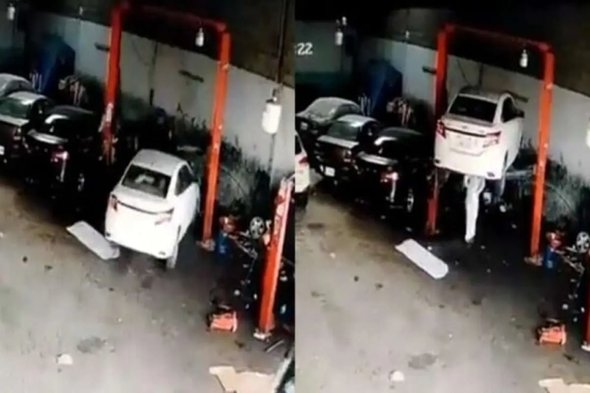(ویدئو) نجات معجزه آسا از سقوط خودرو در تعمیرگاه