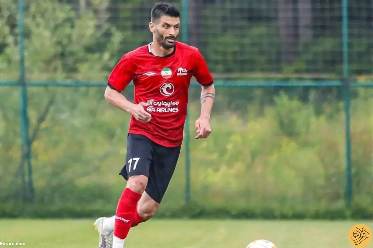 (عکس) بوسه جنجالی یک پرسپولیسی بر لوگوی تراکتور!