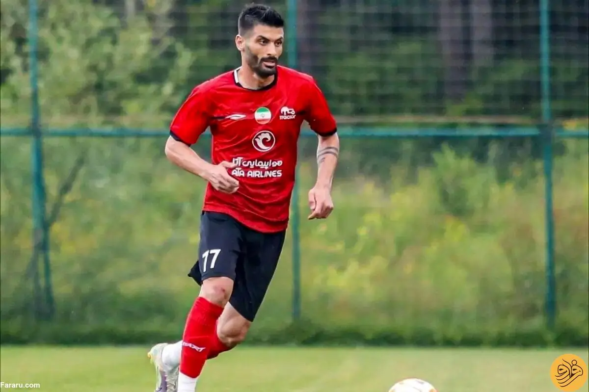 (عکس) بوسه جنجالی یک پرسپولیسی بر لوگوی تراکتور!