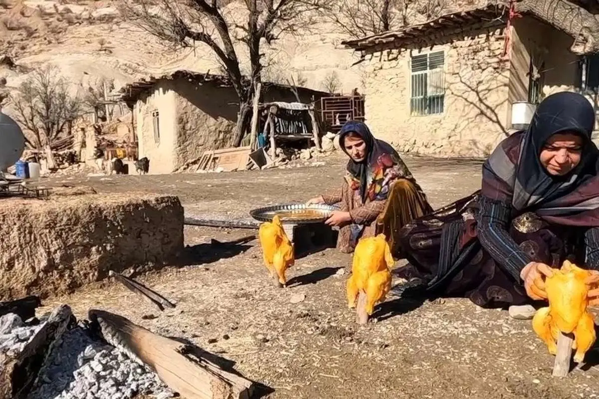 (ویدئو) کباب کردن تماشایی مرغ زیر سطلهای فلزی توسط کدبانوی بختیاری