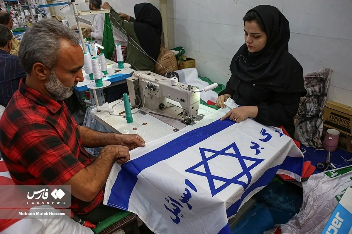 (تصاویر) تولید پرچم فلسطین و اسرائیل در خُمین