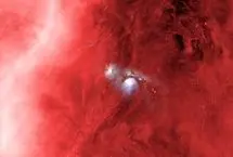 عکس روز ناسا؛ سحابی‌های آبی در میان ابرهای سرخ شکارچی